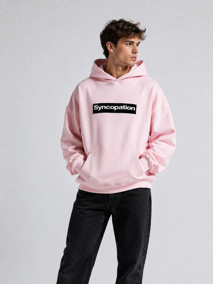Box logo hoodie in blush pink with a black box logo across the chest