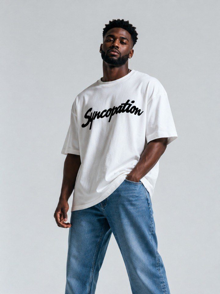 Script tee in bone with the Syncopation script logo across the chest